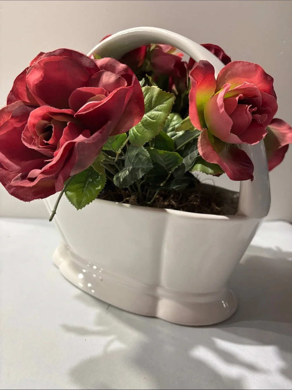 Rose Artificial Arrangement in White Ceramic Basket half moon bay California